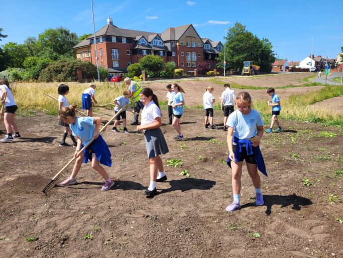 Children from local primary school sowing seeds